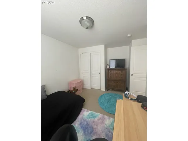 a living room with furniture and flat screen tv