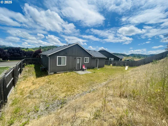 a house with swimming pool in front of it