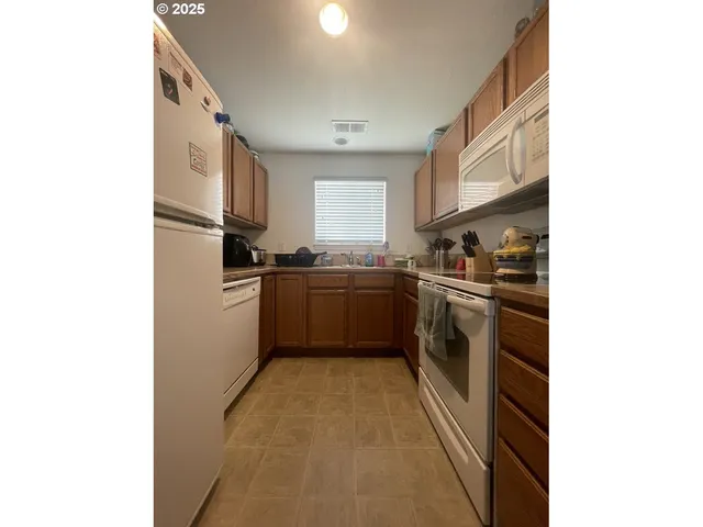a kitchen with cabinets and a sink