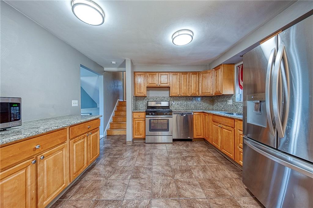 11468 Drop Irwin, PA 15642 - Photo 23 of 49 New SS appliances included plus washer and dryer.