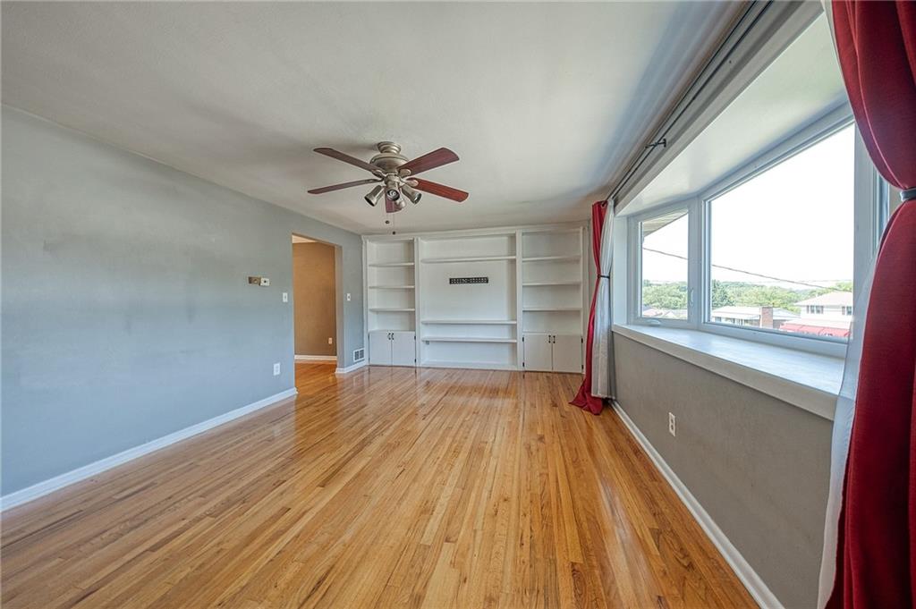 11468 Drop Irwin, PA 15642 - Photo 6 of 49 hardwood floor, new windows, and built in book shelves.