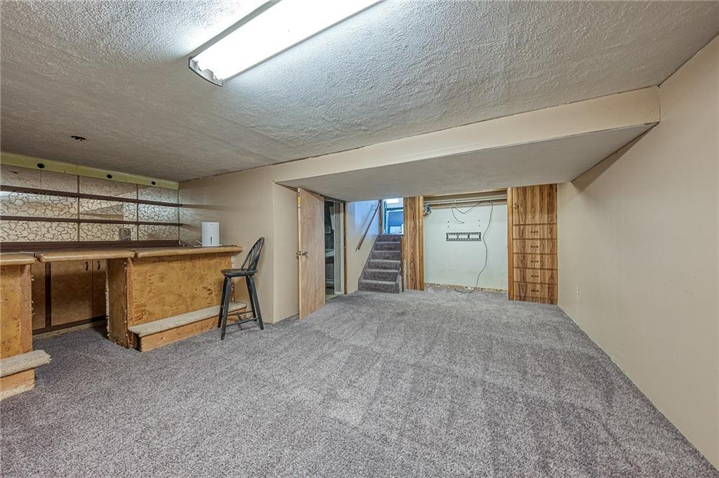 11468 Drop Irwin, PA 15642 - Photo 8 of 49 Nice game room with wall to wall, wet bar.