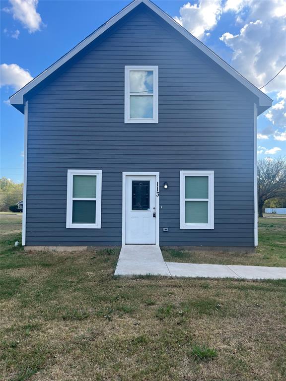 113 King Street Commerce, TX 75428 - Photo 1 of 1 Back of house with a yard