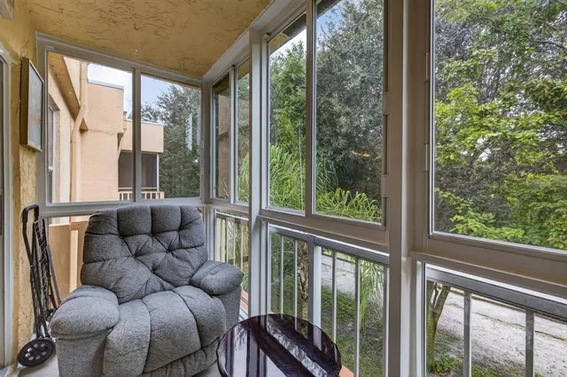 a living room with furniture and windows
