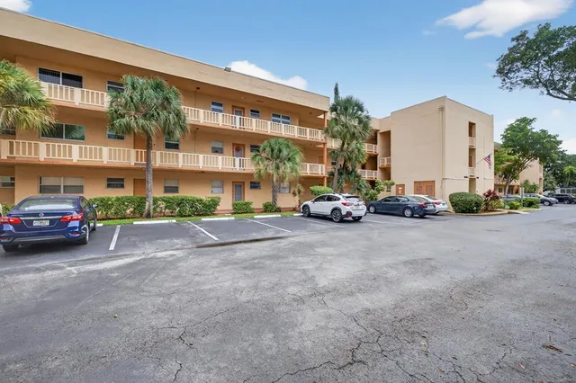 a view of car parked in front of a building