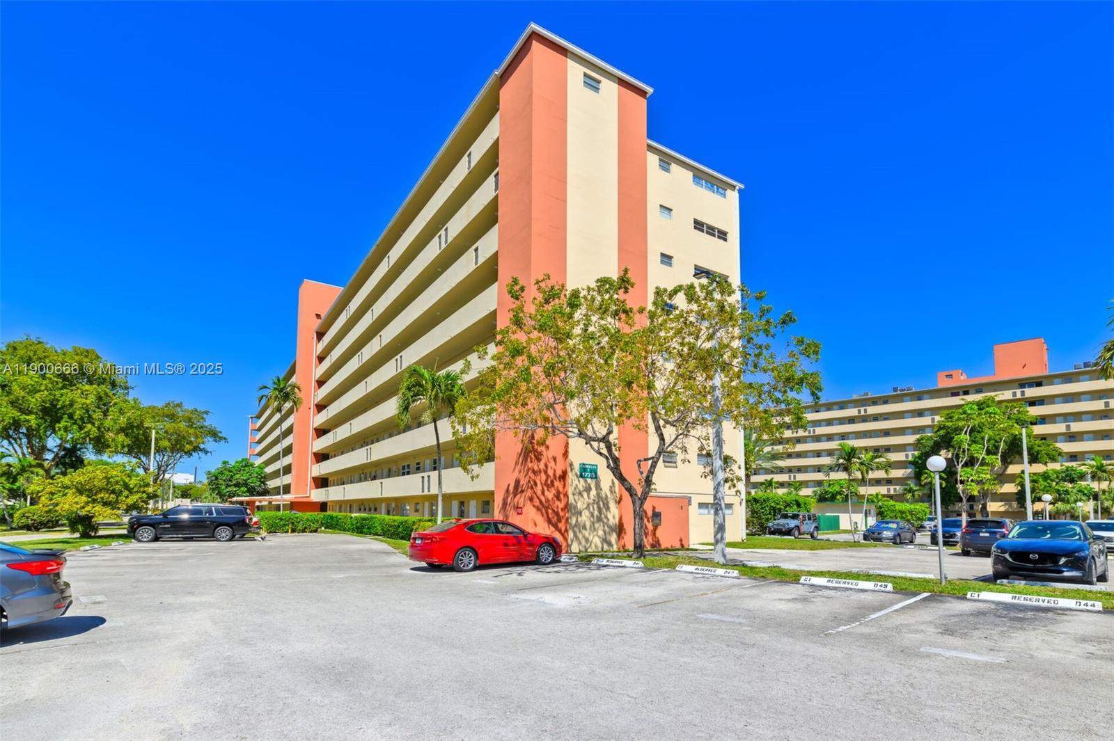 1770 Northeast 191st Street, Unit 5081 Miami, FL 33179 - Photo 11 of 35 a view of a buildings with cars parked in front of it