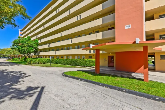 a front view of a building with garden
