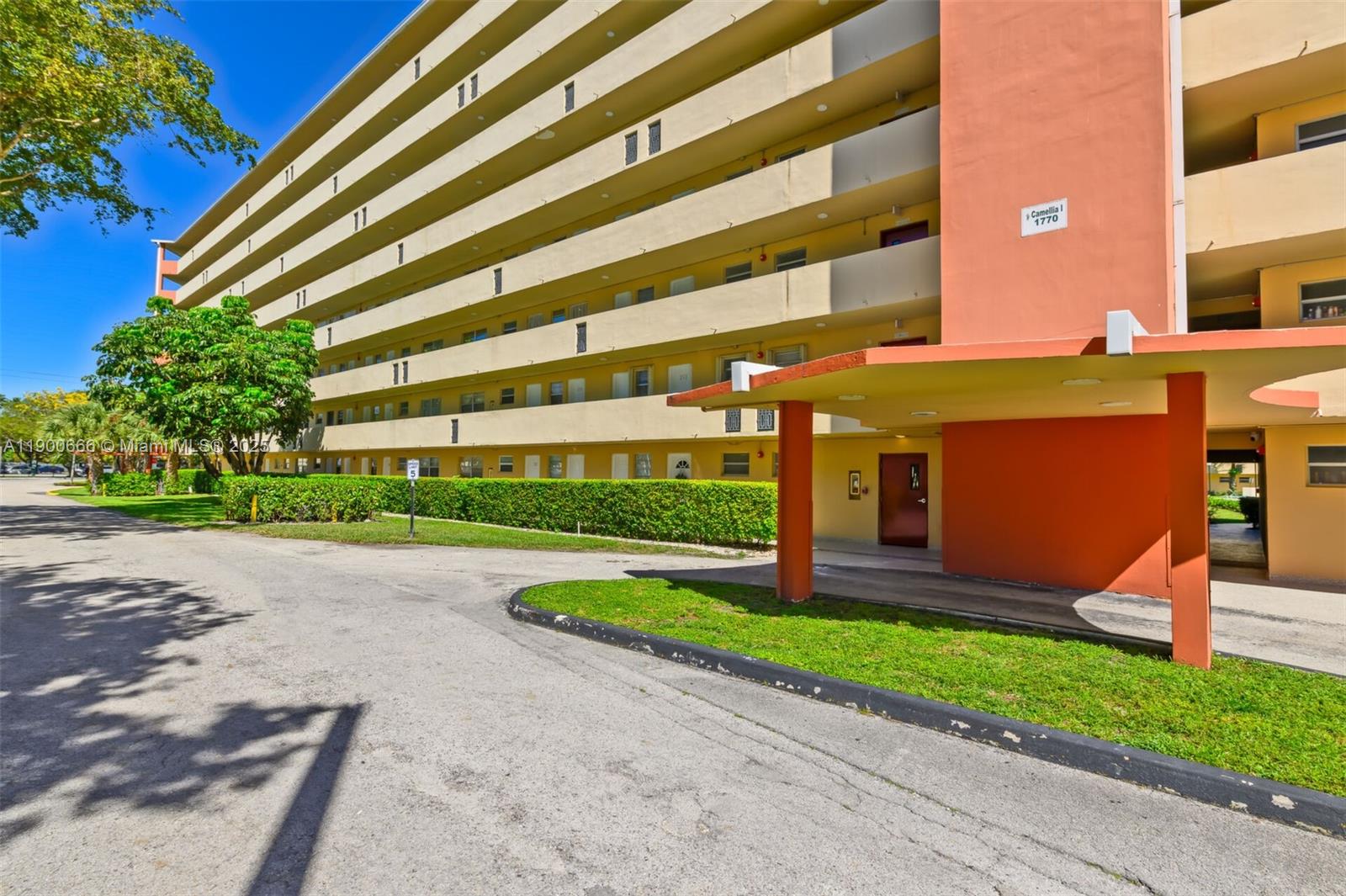 1770 Northeast 191st Street, Unit 5081 Miami, FL 33179 - Photo 14 of 35 a front view of a building with garden