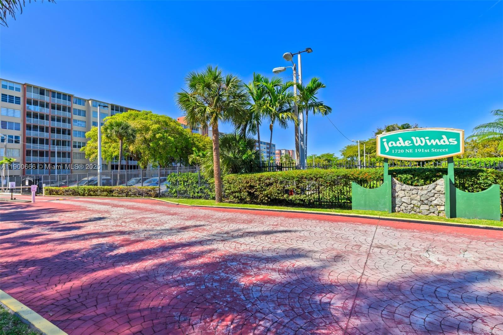 1770 Northeast 191st Street, Unit 5081 Miami, FL 33179 - Photo 15 of 35 a view of a garden with a chair