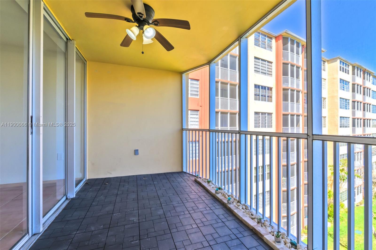 1770 Northeast 191st Street, Unit 5081 Miami, FL 33179 - Photo 3 of 35 a view of a hallway with windows