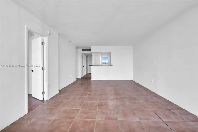 a view of an empty room and window