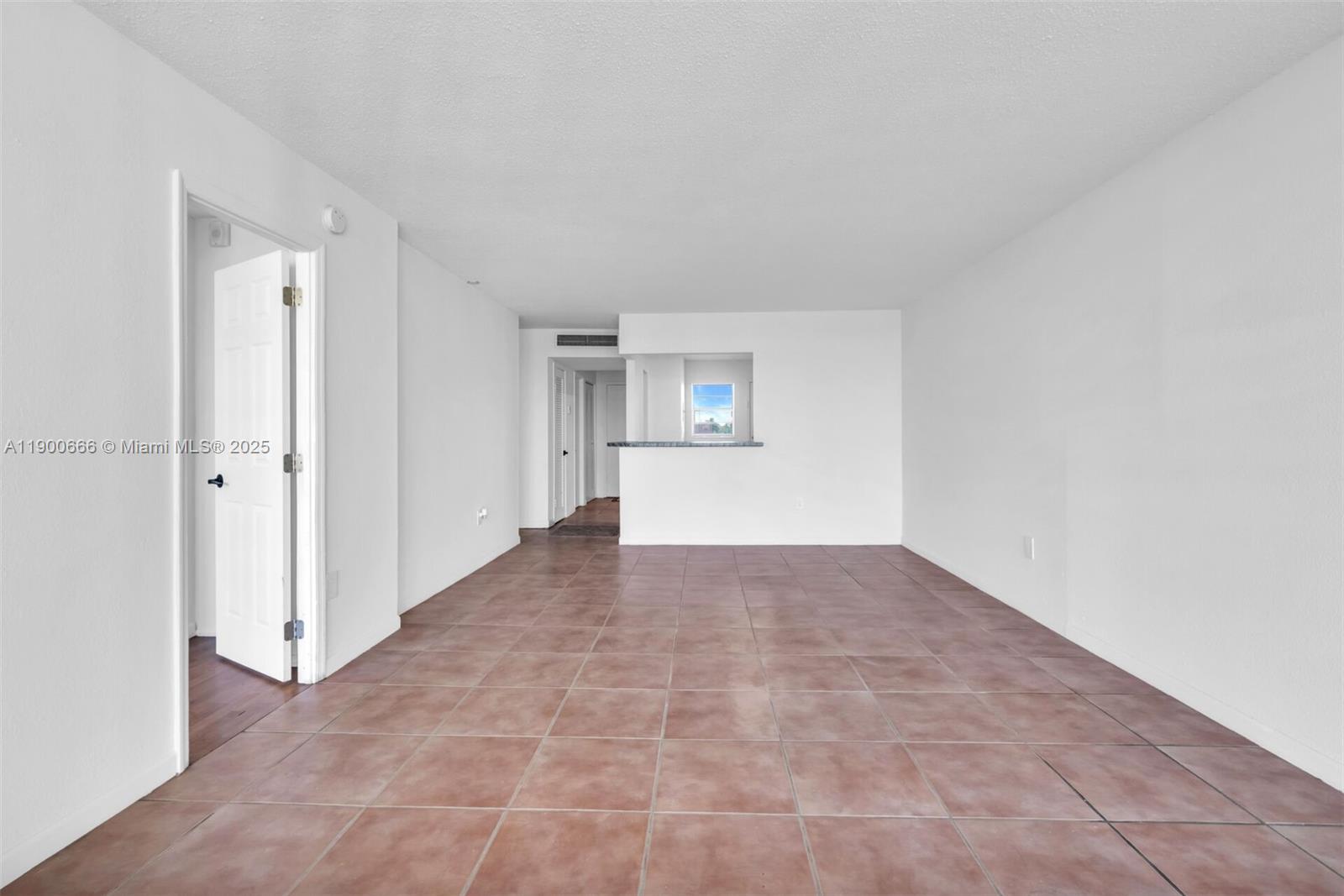 1770 Northeast 191st Street, Unit 5081 Miami, FL 33179 - Photo 31 of 35 a view of an empty room and window