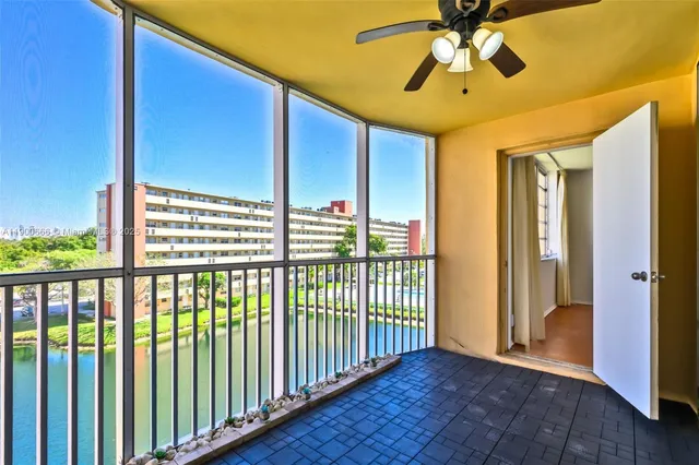 a view of a porch with wooden floor