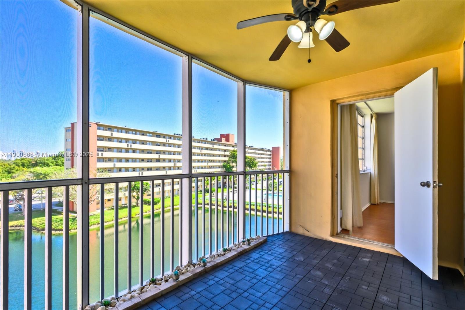 1770 Northeast 191st Street, Unit 5081 Miami, FL 33179 - Photo 4 of 35 a view of a porch with wooden floor