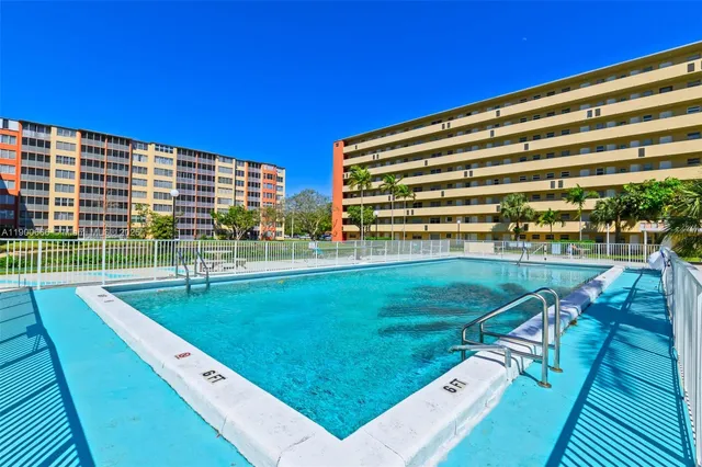a view of a swimming pool with a patio