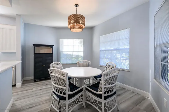 a dining room with furniture and window