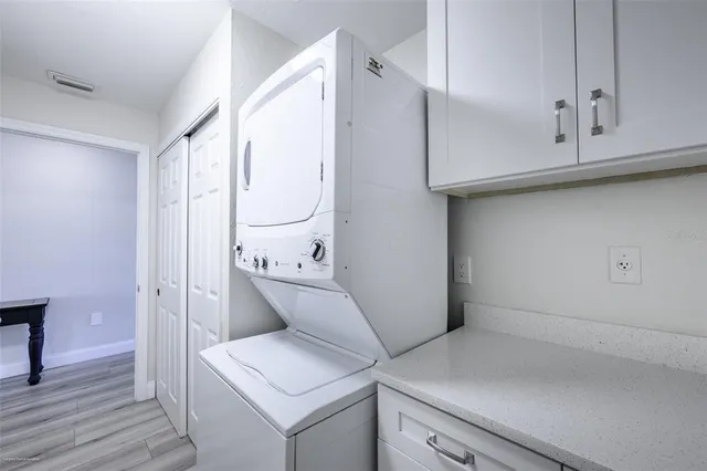 a utility room with cabinets