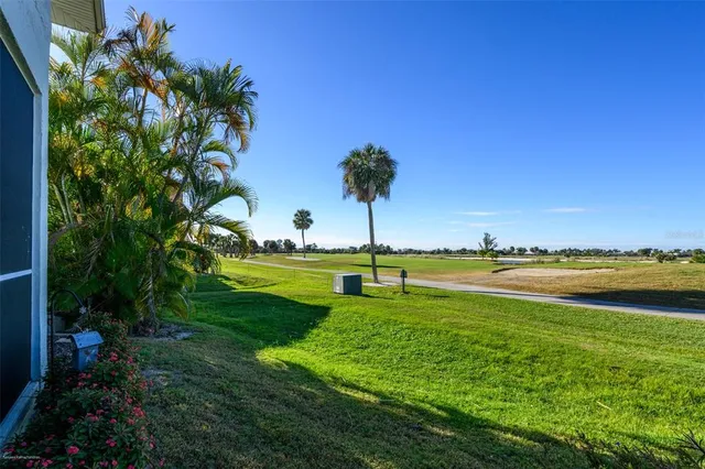 a view of a swimming pool with a yard