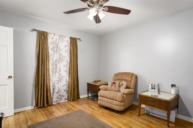 a living room with furniture and a window