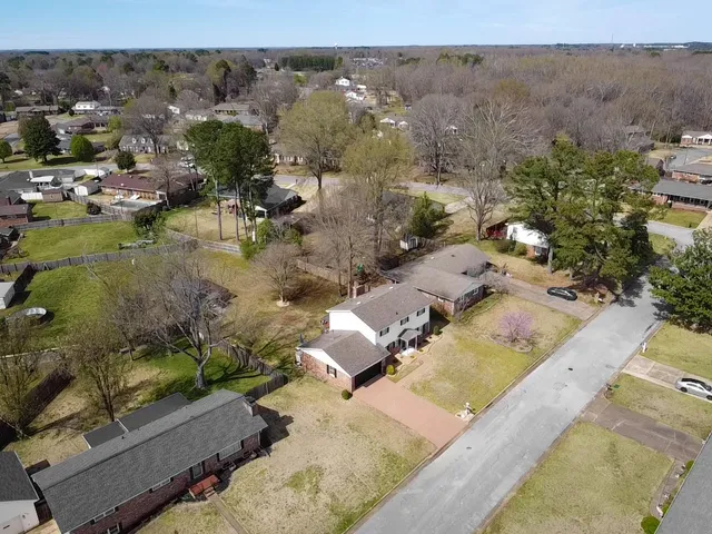 a view of yard with swimming pool and trees