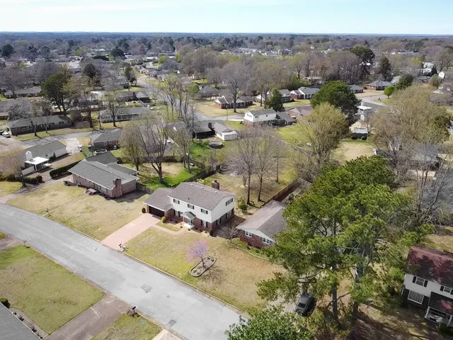 a view of a swimming pool with a yard and mountain view