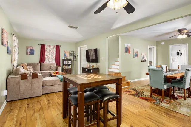a view of a livingroom with furniture and a flat screen tv