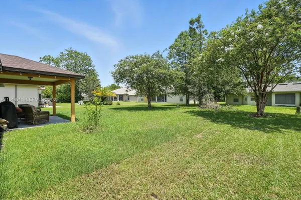 a view of a house with a big yard