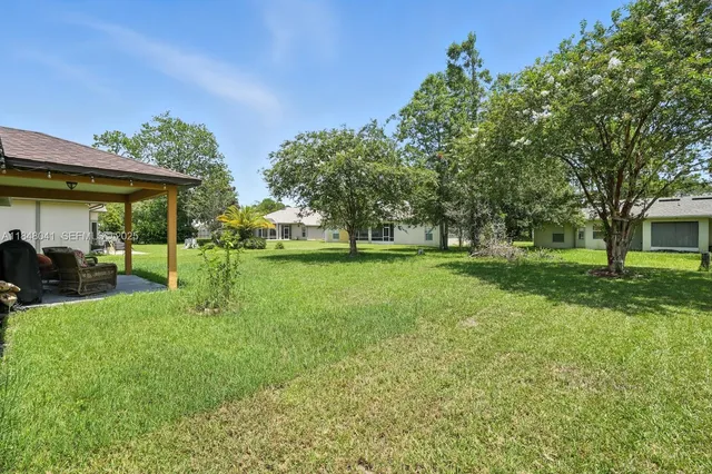 a view of a house with a big yard