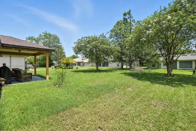 a view of a house with a big yard