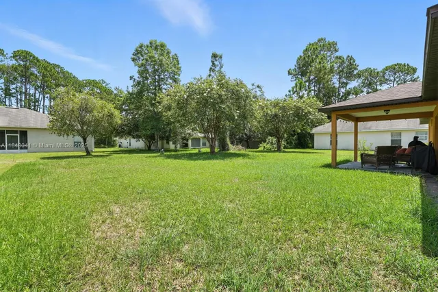 a outdoor living space with furniture and a yard