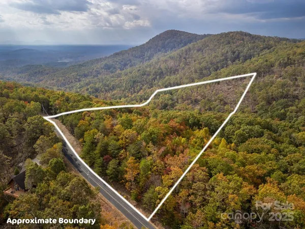 a view of a sign board with mountain