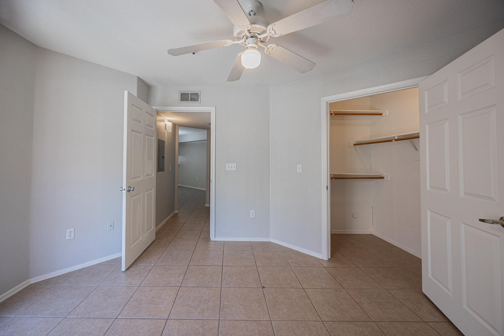 1287 North Alma School Road, Unit 131 Chandler, AZ 85224 - Photo 16 of 24 an empty room with closet and a ceiling fan