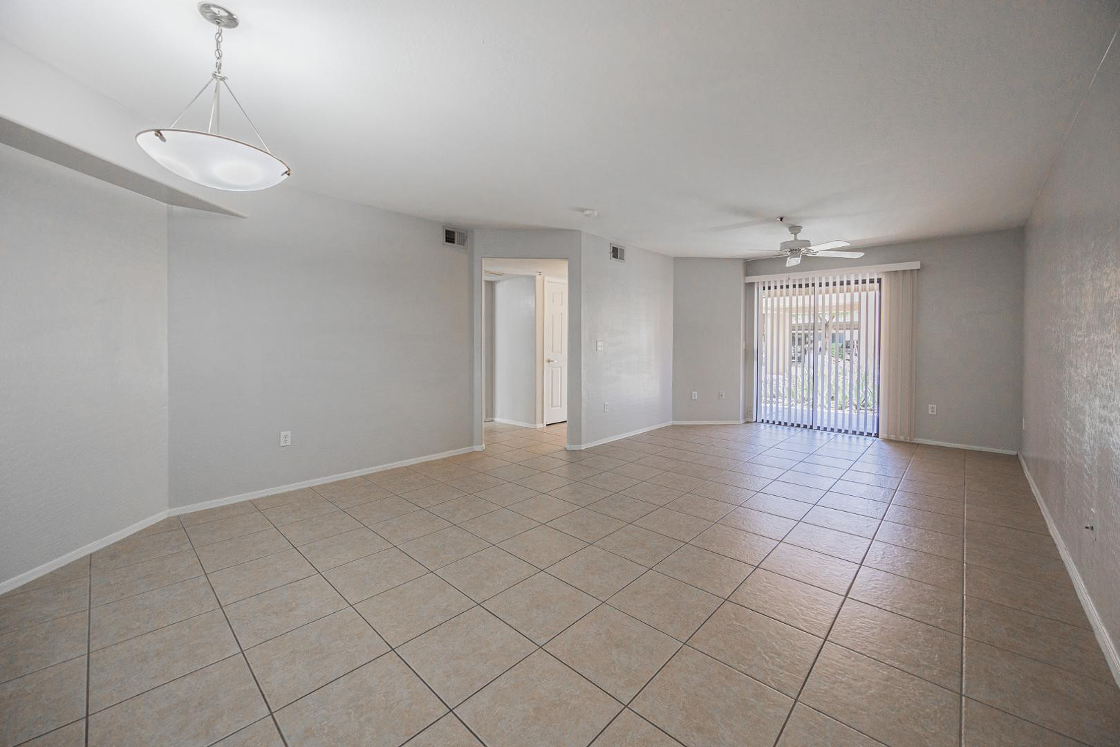 1287 North Alma School Road, Unit 131 Chandler, AZ 85224 - Photo 3 of 24 a view of an empty room with a window