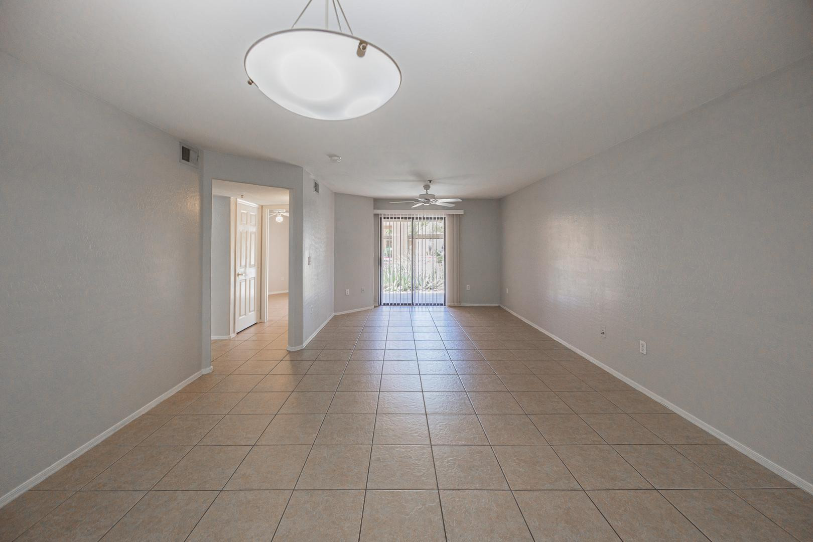 1287 North Alma School Road, Unit 131 Chandler, AZ 85224 - Photo 7 of 24 a view of an empty room with a window