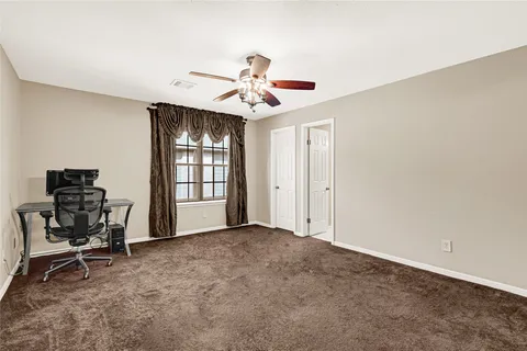 a view of an empty room with a bathroom