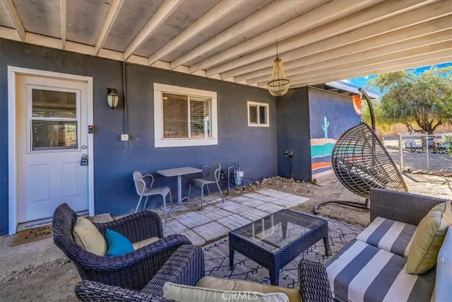 a dinning table and chairs in a patio
