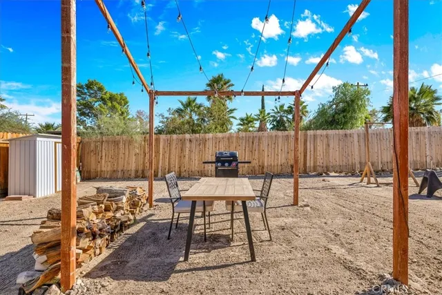a view of a chairs and table in the patio