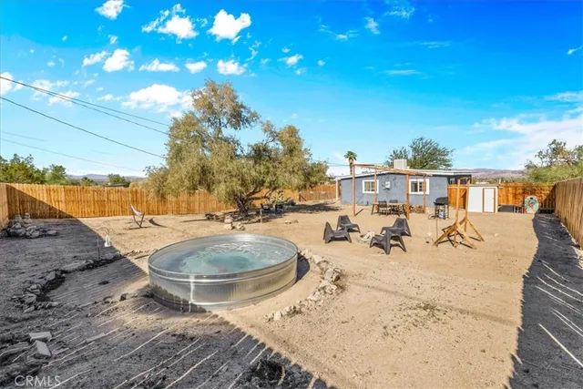 a view of a swimming pool with a patio