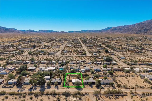 an aerial view of residential house with outdoor space