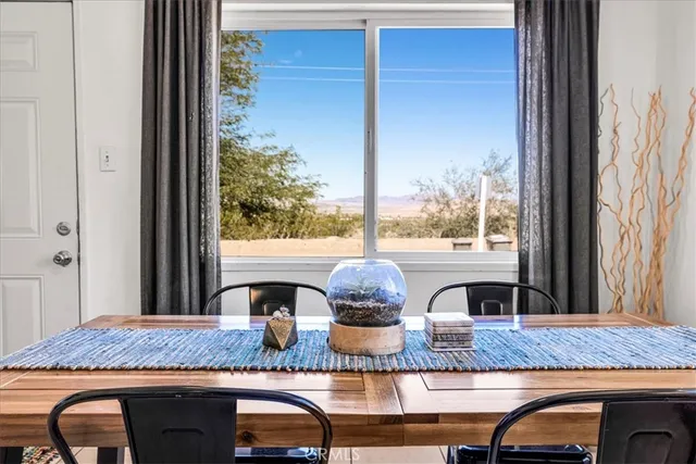a bathroom with a granite countertop sink and mirror