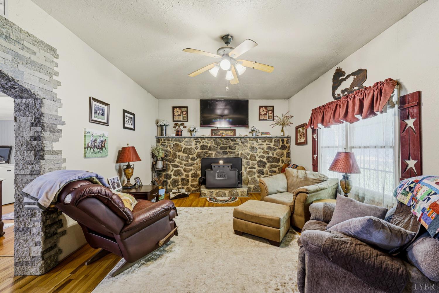 809 Plantation Road Amherst, VA 24521 - Photo 6 of 77 a living room with furniture and a fireplace