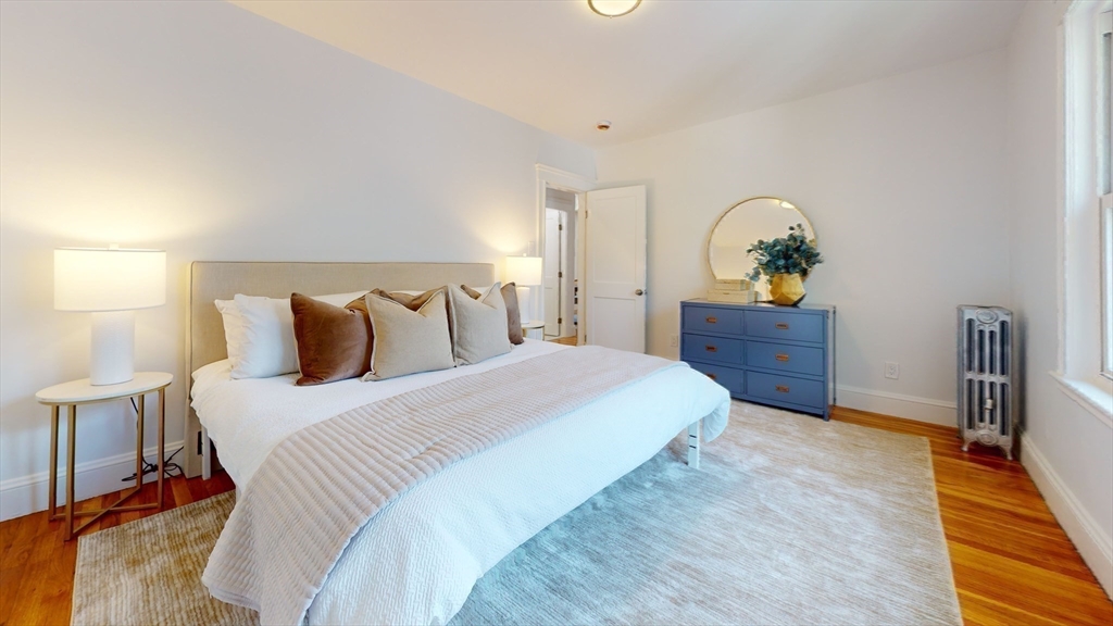 333 Vermont Street, Unit 2 Boston, MA 02132 - Photo 11 of 24 a bedroom with a bed and a dresser