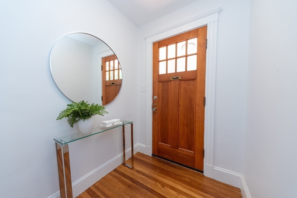 333 Vermont Street, Unit 2 Boston, MA 02132 - Photo 2 of 24 an entryway with wooden floor and a potted plant