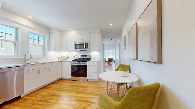 a kitchen with a sink cabinets and window