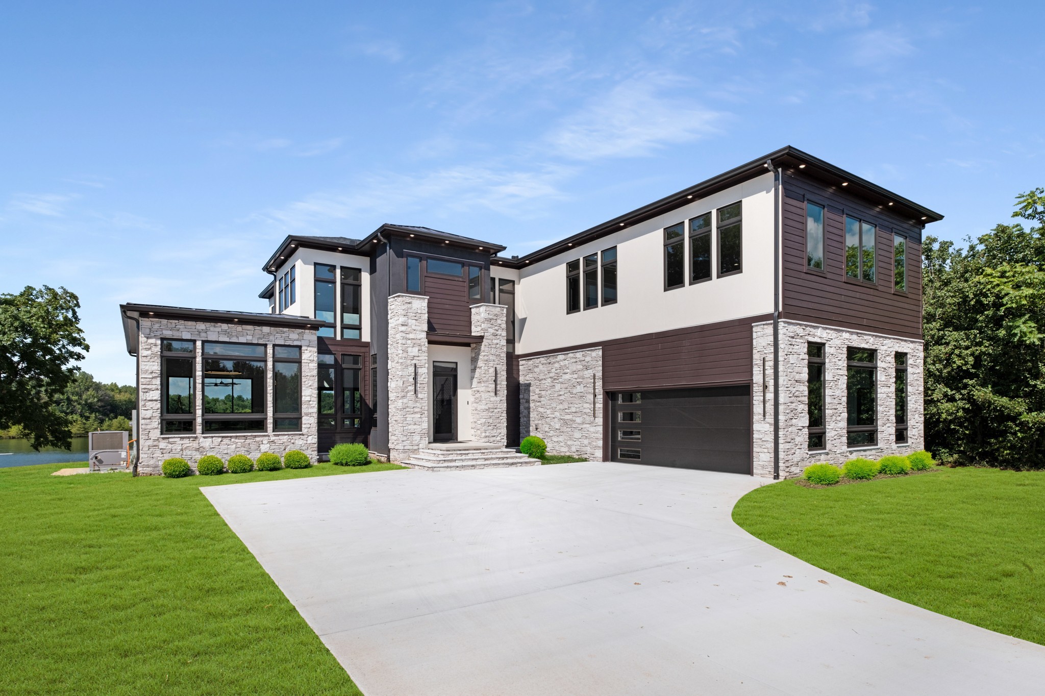 613 Waters Edge Drive Estill Springs, TN 37330 - Photo 15 of 36 a front view of a house with a yard and garage