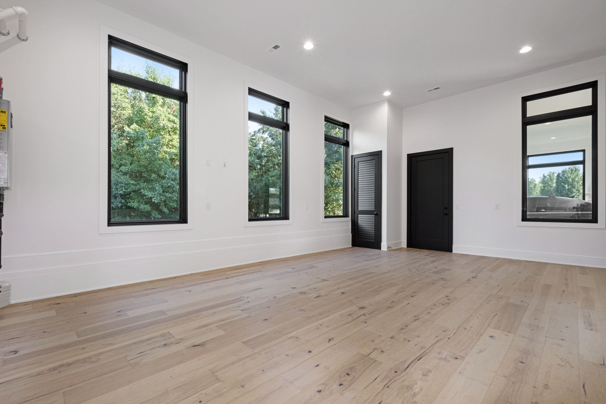 613 Waters Edge Drive Estill Springs, TN 37330 - Photo 24 of 36 a view of an empty room with wooden floor and a window