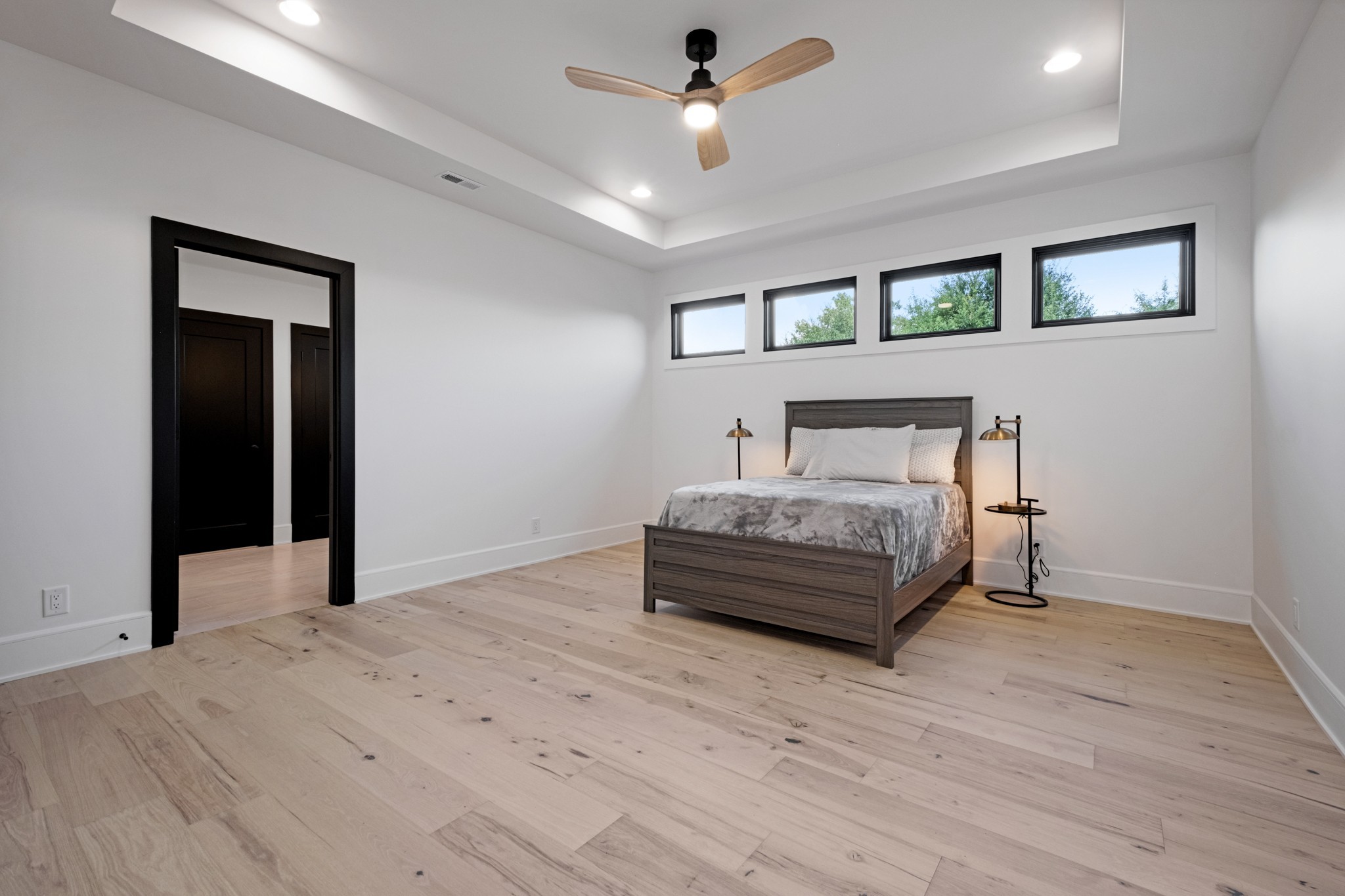 613 Waters Edge Drive Estill Springs, TN 37330 - Photo 25 of 36 a bedroom with a bed and a chandelier