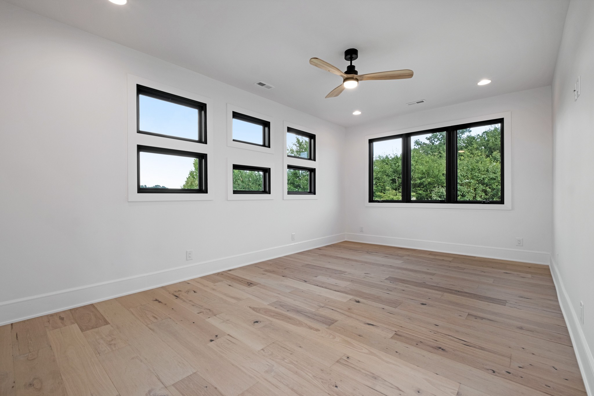 613 Waters Edge Drive Estill Springs, TN 37330 - Photo 29 of 36 a view of an empty room with wooden floor and a window