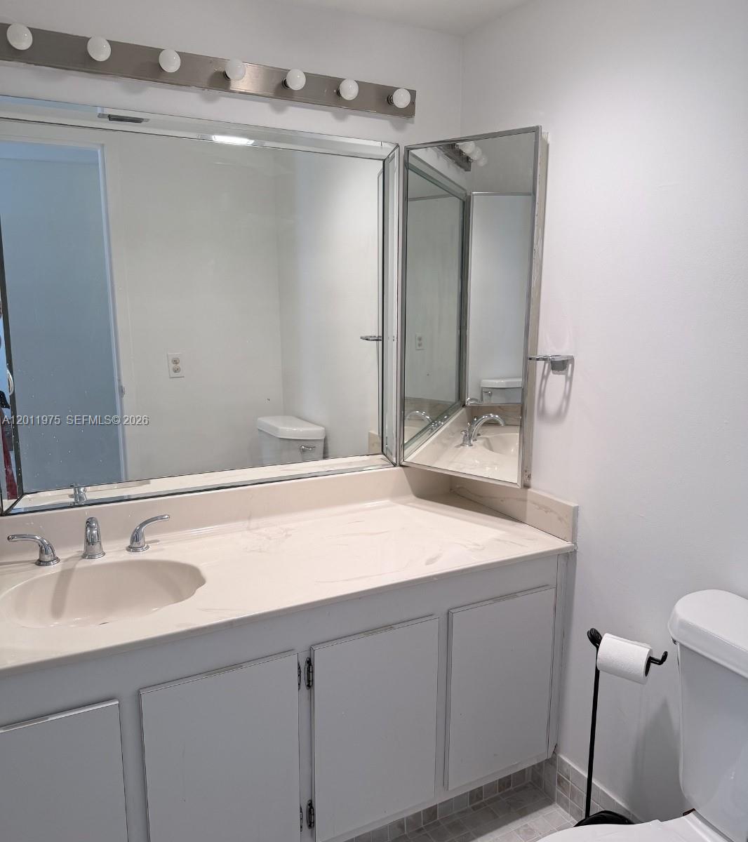 2501 Brickell Avenue, Unit 804 Miami, FL 33129 - Photo 10 of 18 Master bathroom with large vanity separated from the toilet
