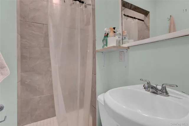 a bathroom with a sink and mirror